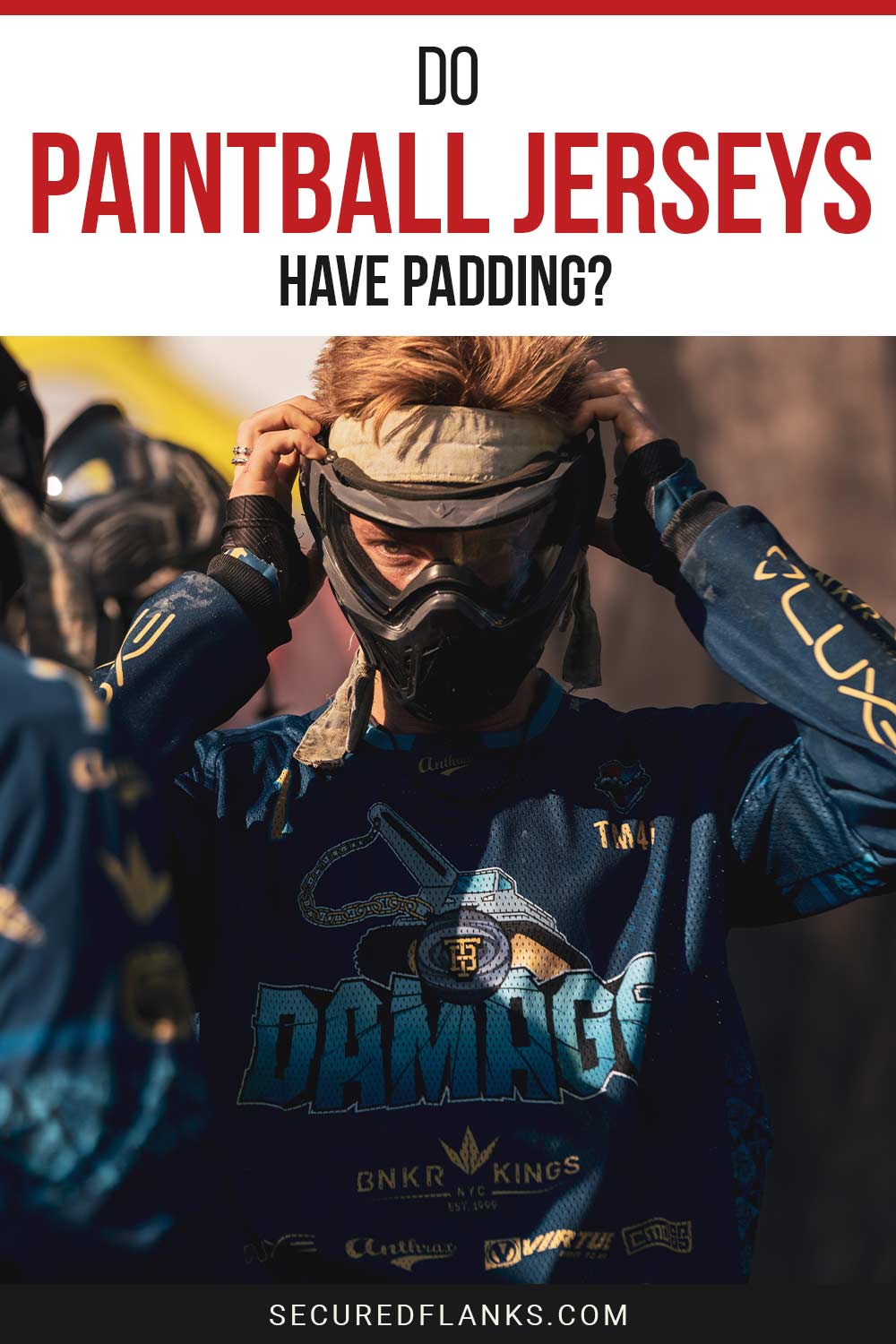 Person wearing a paintball jersey holding the helmet on head - do these jerseys have padding?