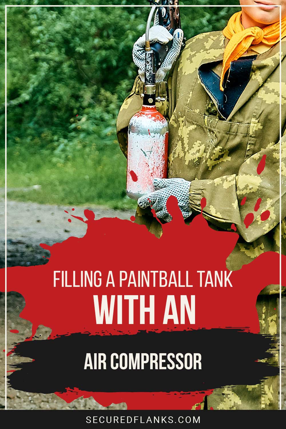 Person holding an air compressor - Filling a Paintball Tank with one.