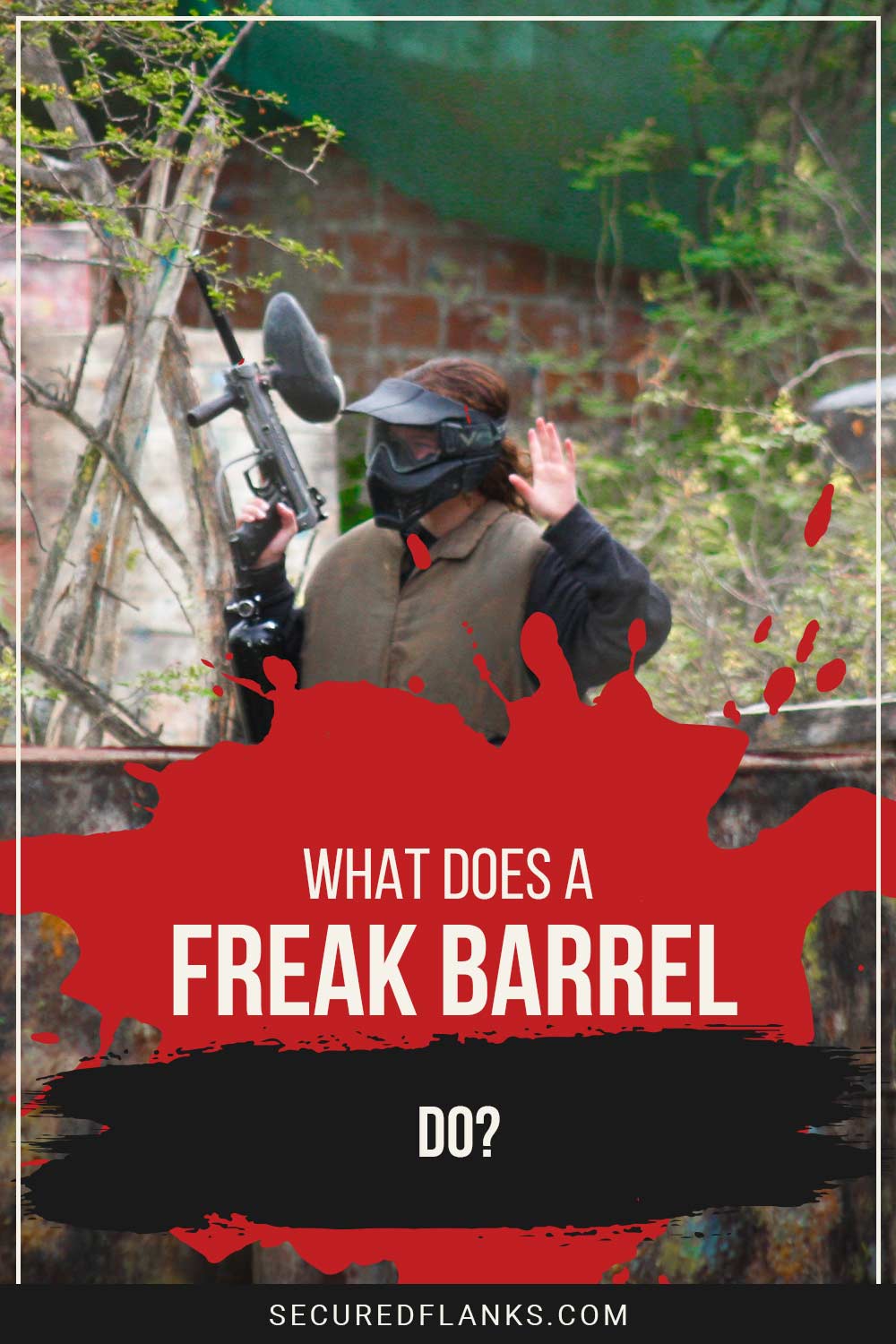 Person wearing helmet and a paintball gun in hand holding hands up - What Does a Freak Barrel Do?