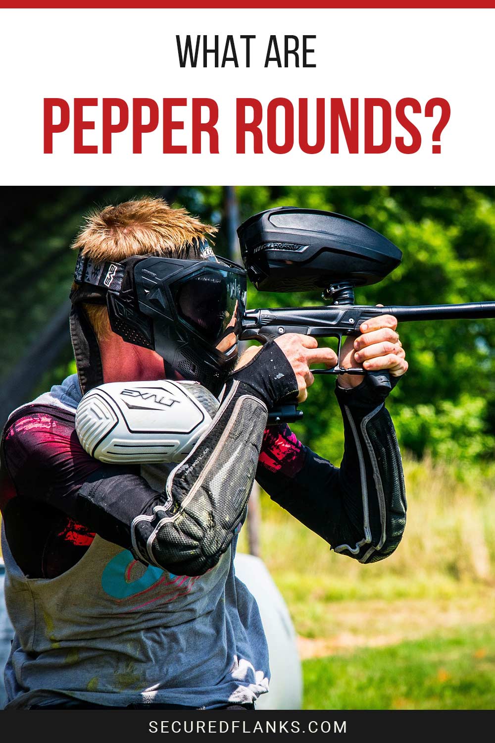Man wearing paintball gears pointing a paintball gun - What Are Pepper Rounds?