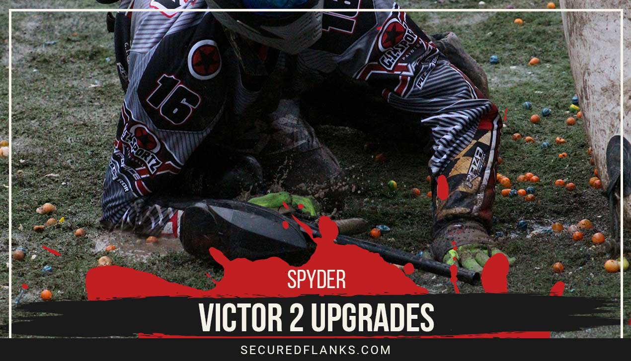 Person crawling with a paintball gun in hand - Spyder Victor 2 Upgrades.